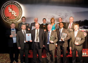 Back row from left are: Peter de Bruijne, Sam Croft, Steve Coghill, all of Noble Drilling; news presenter Jackie Bird; Donald MacFarlane of NOV Brandt; and Roger Hodgson of KCA DEUTAG. Front row from left are Gert-Jan Windhorst of Noble; Gavin Sutherland and Jim Cameron of KCA DEUTAG; Russell Robertson of Transocean; Clement Ejebu of Stena Drilling; and Ivor McBean of Diamond Offshore. 