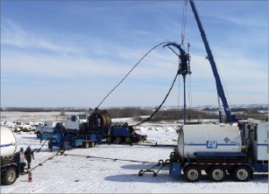 A coiled-tubing winter operation is carried out near Red Deer, Alberta, Canada.