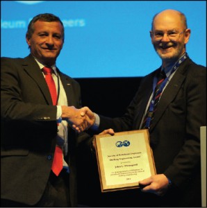 2011 SPE president Alain Labastie (left) presents the 2011 SPE Drilling Engineering Award to Dr John Thorogood on 2 March in Amsterdam.