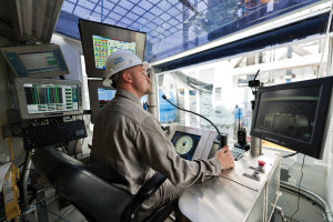 A driller sits inside the driller’s cabin on an advanced-technology rig. Mechanization is extensive on the advanced rigs Oxy uses, though automating complex tasks is not a specific goal for the company. 