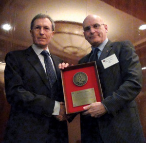 Mike Hoyle (left) accepts an IADC Exemplary Service Award from IADC president and CEO Stephen Colville.