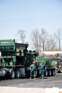 FTSI employees Peter Ballard and Chris Hightower work on the field test of one of the company’s dual-fuel pressure-pumping units in the Marcellus Shale. FTSI’s pressure-pumping equipment was retrofitted with Caterpillar’s DGB kit for the test.