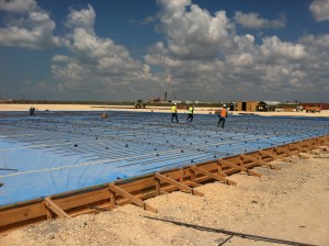 Construction workers build the warehouse and yard at Kiewit’s Ingleside facility near Corpus Christi, Texas. The facility will provide for the storage, maintenance and testing needs of MWCC’s ECS plan.