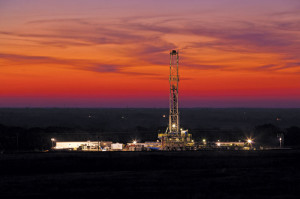 Helmerich & Payne Rig 328 from the FlexRig4S series works for Devon Energy in Logan County, Okla., in the Mississippian Woodford Trend in September 2013. Devon currently has 15 rigs working in the oil play, averaging 15 days of drilling time per well.