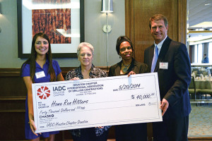 The IADC Houston Chapter presents a check to Home Run Hitters International for $40,000. From left are Allison Fraser, Rowan; Marcy Sandell, mother of a Home Run Hitters student; Dr Deborah Carr, Home Run Hitters; and Scott Gordon, Derrick Equipment.