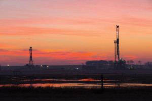 The Nabors M-44 Rig (left) and Nabors Pace-X Rig 05 operate in Yoakum, Texas, in the Eagle Ford play. The PACE-X rigs are designed for multiwell drilling on pads. With the new generation of mast and substructures, drilling contractors can reduce the number of loads and connections to make rig moves more efficient between pads and with smaller-sized loads.