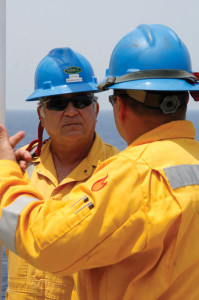 George Silva, Captain of the Noble Bully I drillship, communicates with a crew member on the rig. Noble has developed several training courses addressing the way its offshore crews interact with each other and with their work environment.