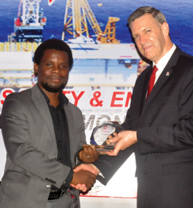 IADC VP of International Operations Mike DuBose (right) presents Tunji Adenuga of Indigo Drilling with the award for most improved company at the IADC Nigeria Chapter Safety Awards dinner on 30 March in Lagos, Nigeria. Oando Energy Services was named overall winner.