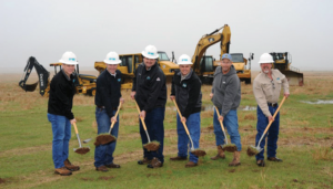 Newfield Exploration Company employees break ground on a water recycling facility in Kingfisher County, Okla.