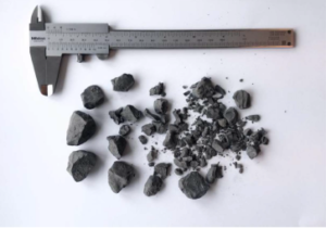 This picture shows some of the larger cuttings found at the shaker during the drilling operation. Since the formation was predominately clay, the bulk of the cuttings were very small, less than 1 mm in size. When drilling occasional stringers, some larger cuttings size were observed. The bottoms-up time for the cuttings was estimated to be about 9 minutes at TD. 