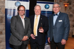 OOC Executive Director Evan Zimmerman (left) and Associate Director Greg Southworth (right) presented Alan Spackman with an OOC Lifetime Membership Award at the committee’s 70th anniversary meeting. The award, which has only been given out five times previously, honors an individual who has made a significant and lasting footprint on the offshore industry. 