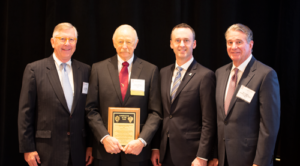 Trent Latshaw (second from left), President of Latshaw Drilling Co, was named 2018 IADC Contractor of the Year. Mr Latshaw received his award on 9 November at the 2018 IADC Annual General Meeting in New Orleans from Loren Singletary (left), Chief Investor and Industry Relations Officer for NOV; Jason McFarland (second from right), IADC President; and Bill Crabbe, Chief HSE Officer for NOV.