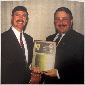 Alex Newton (left), then President of Reed Tool Company (now NOV ReedHycalog), presents the 1996 Contractor of the Year Award to Cary Moomjian (right), then VP and General Counsel for Santa Fe International Corp, at the 1996 IADC Board of Directors Meeting in New Orleans, Louisiana.